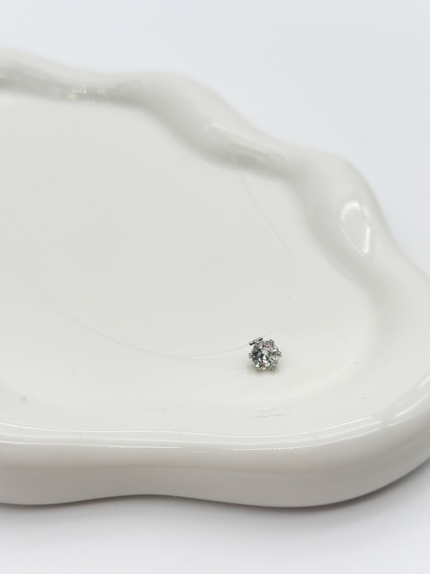 PUNTO LUCE con filo trasparente